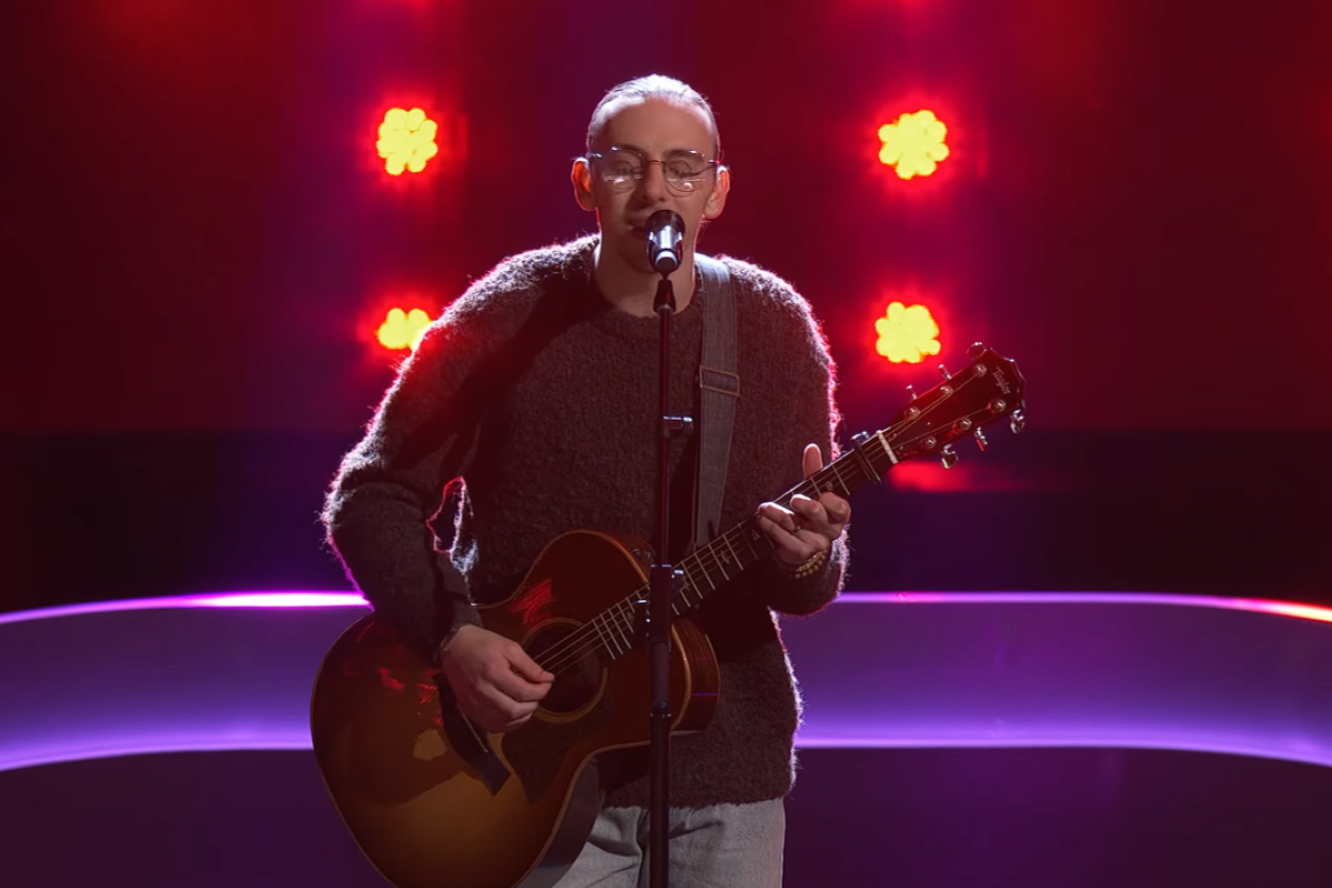 Ethan Eckenroad singing and playing guitar