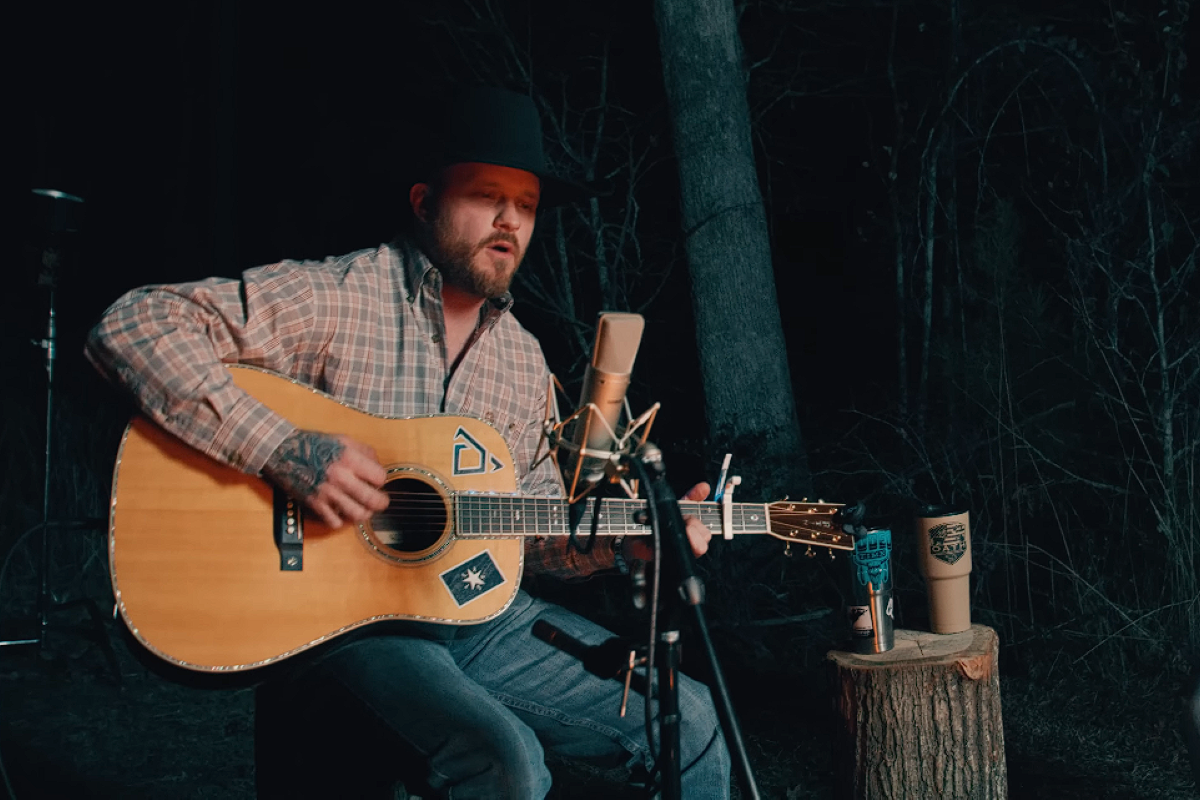 Cody Johnson singing and playing guitar