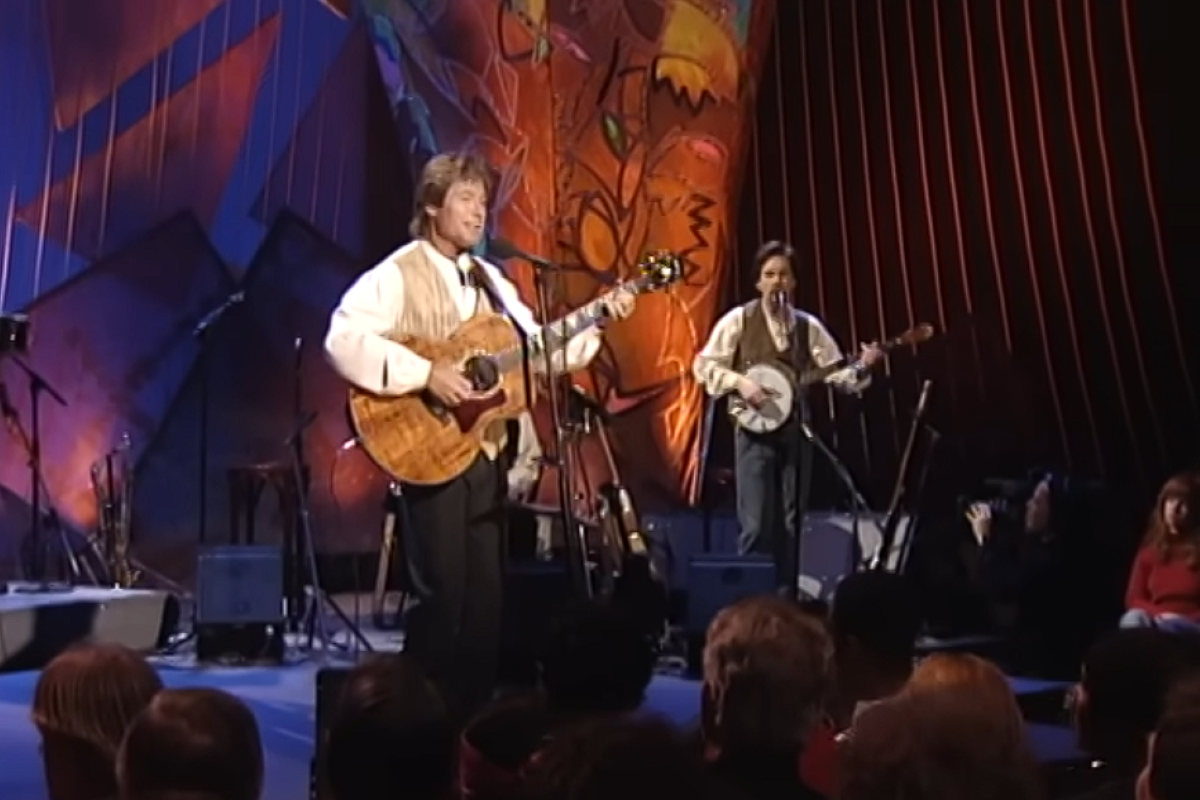 John Denver performing in front of an audience